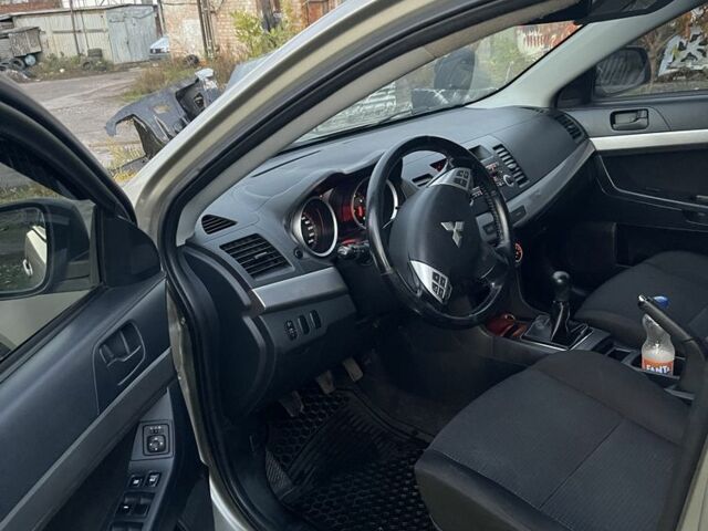 Бежевый Мицубиси Лансер Эволюшн, объемом двигателя 2 л и пробегом 155 тыс. км за 6950 $, фото 11 на Automoto.ua