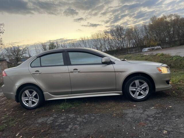 Бежевый Мицубиси Лансер Эволюшн, объемом двигателя 2 л и пробегом 155 тыс. км за 6950 $, фото 4 на Automoto.ua