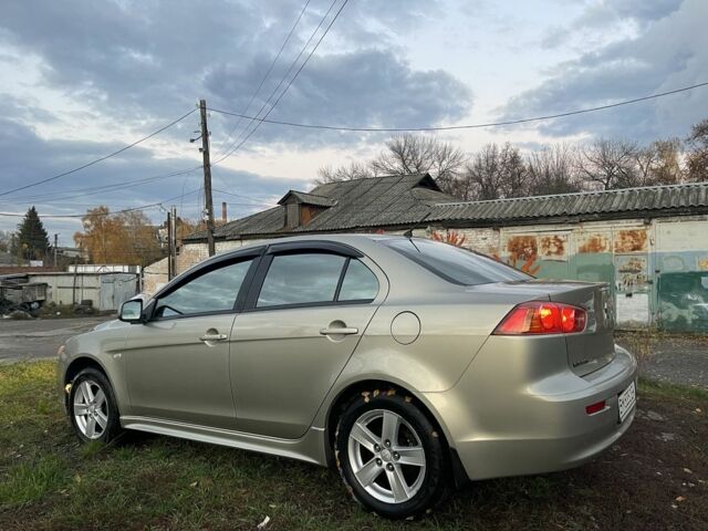 Бежевый Мицубиси Лансер Эволюшн, объемом двигателя 2 л и пробегом 155 тыс. км за 6950 $, фото 2 на Automoto.ua