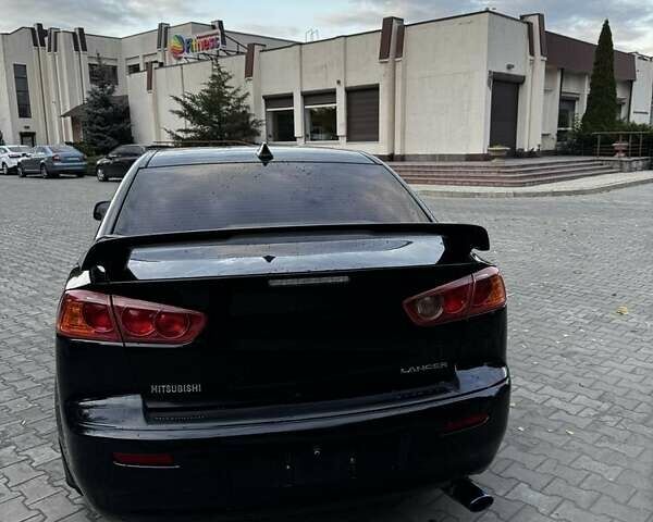 Черный Мицубиси Лансер Эволюшн, объемом двигателя 2 л и пробегом 276 тыс. км за 7300 $, фото 4 на Automoto.ua