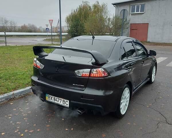 Черный Мицубиси Лансер Эволюшн, объемом двигателя 2 л и пробегом 116 тыс. км за 16900 $, фото 4 на Automoto.ua