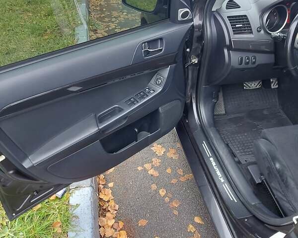 Черный Мицубиси Лансер Эволюшн, объемом двигателя 2 л и пробегом 116 тыс. км за 16900 $, фото 13 на Automoto.ua