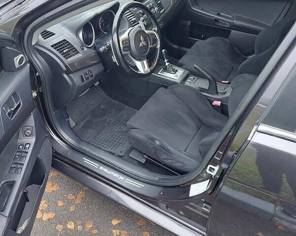 Черный Мицубиси Лансер Эволюшн, объемом двигателя 2 л и пробегом 116 тыс. км за 16900 $, фото 12 на Automoto.ua