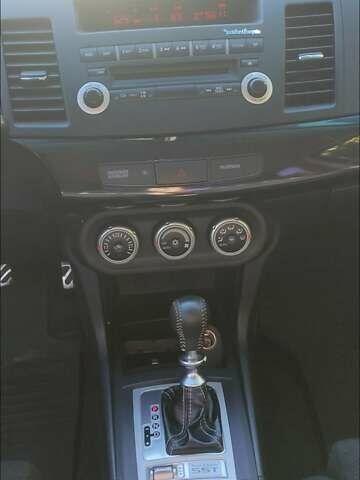 Черный Мицубиси Лансер Эволюшн, объемом двигателя 2 л и пробегом 134 тыс. км за 26737 $, фото 4 на Automoto.ua