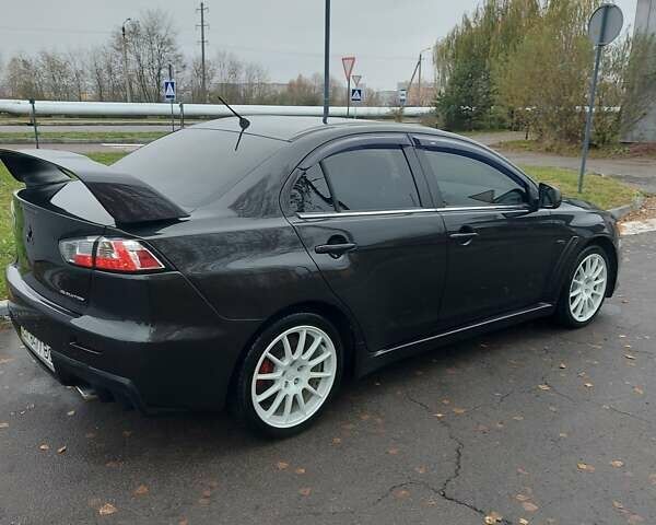 Черный Мицубиси Лансер Эволюшн, объемом двигателя 2 л и пробегом 116 тыс. км за 16900 $, фото 3 на Automoto.ua