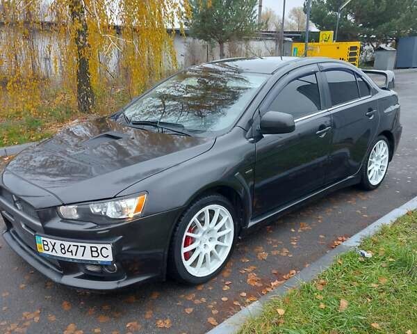 Черный Мицубиси Лансер Эволюшн, объемом двигателя 2 л и пробегом 116 тыс. км за 16900 $, фото 2 на Automoto.ua