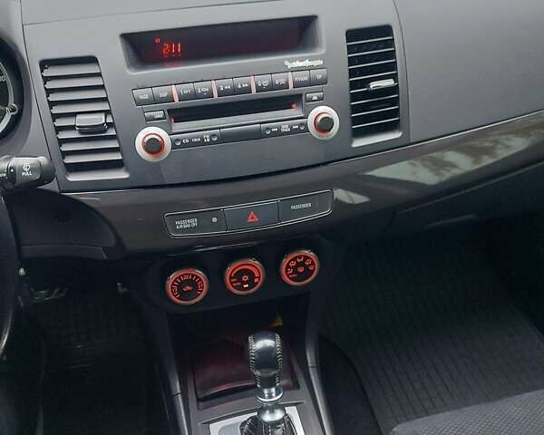 Черный Мицубиси Лансер Эволюшн, объемом двигателя 2 л и пробегом 116 тыс. км за 16900 $, фото 14 на Automoto.ua