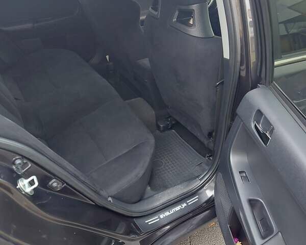 Черный Мицубиси Лансер Эволюшн, объемом двигателя 2 л и пробегом 116 тыс. км за 16900 $, фото 9 на Automoto.ua