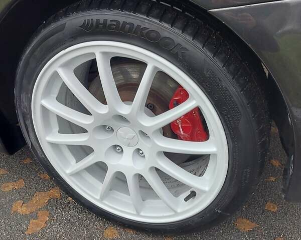 Черный Мицубиси Лансер Эволюшн, объемом двигателя 2 л и пробегом 116 тыс. км за 16900 $, фото 20 на Automoto.ua