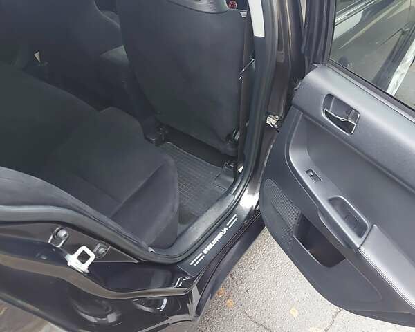 Черный Мицубиси Лансер Эволюшн, объемом двигателя 2 л и пробегом 116 тыс. км за 16900 $, фото 7 на Automoto.ua