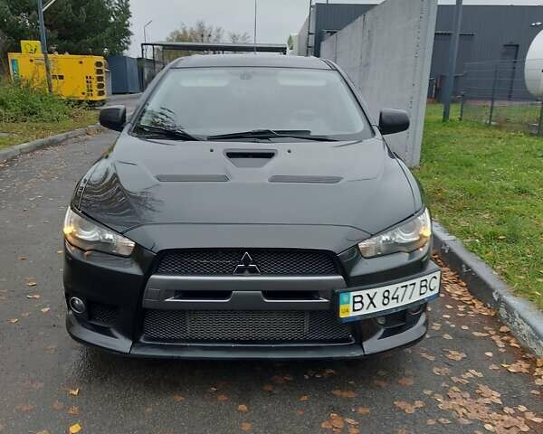 Черный Мицубиси Лансер Эволюшн, объемом двигателя 2 л и пробегом 116 тыс. км за 16900 $, фото 6 на Automoto.ua