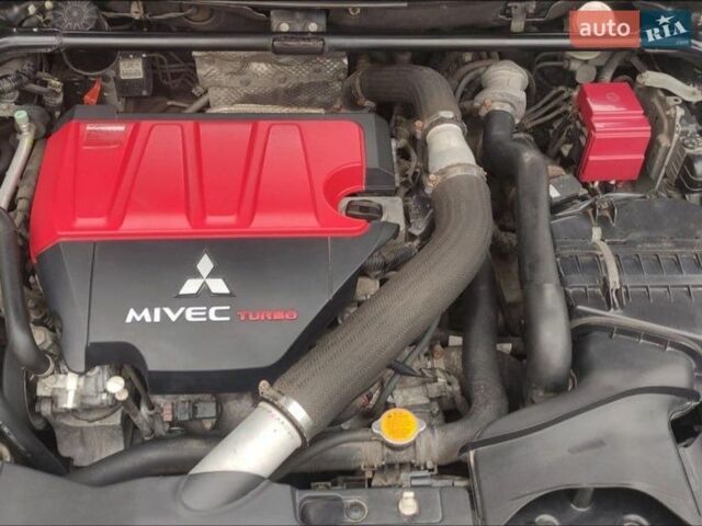 Черный Мицубиси Лансер Эволюшн, объемом двигателя 2 л и пробегом 134 тыс. км за 21000 $, фото 3 на Automoto.ua