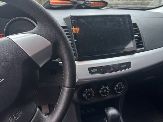 Черный Мицубиси Лансер Эволюшн, объемом двигателя 1.5 л и пробегом 252 тыс. км за 6100 $, фото 5 на Automoto.ua