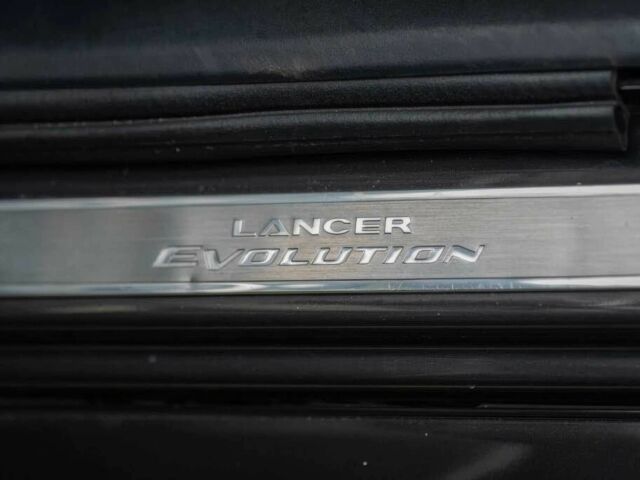 Черный Мицубиси Лансер Эволюшн, объемом двигателя 2 л и пробегом 90 тыс. км за 6400 $, фото 8 на Automoto.ua