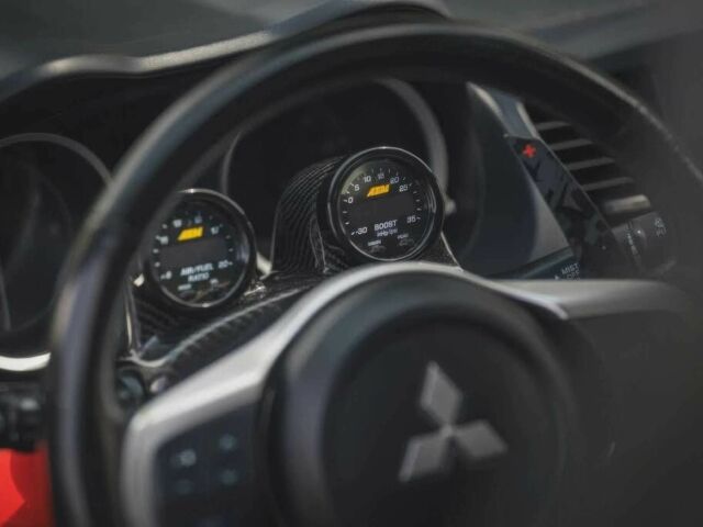 Черный Мицубиси Лансер Эволюшн, объемом двигателя 2 л и пробегом 90 тыс. км за 6400 $, фото 5 на Automoto.ua