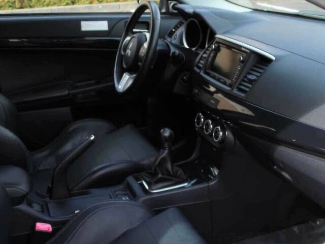 Черный Мицубиси Лансер Эволюшн, объемом двигателя 2 л и пробегом 88 тыс. км за 6400 $, фото 8 на Automoto.ua