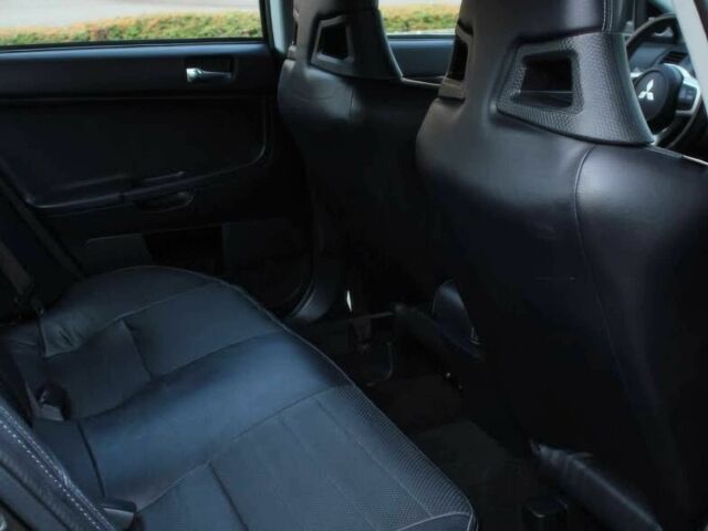 Черный Мицубиси Лансер Эволюшн, объемом двигателя 2 л и пробегом 88 тыс. км за 6400 $, фото 9 на Automoto.ua