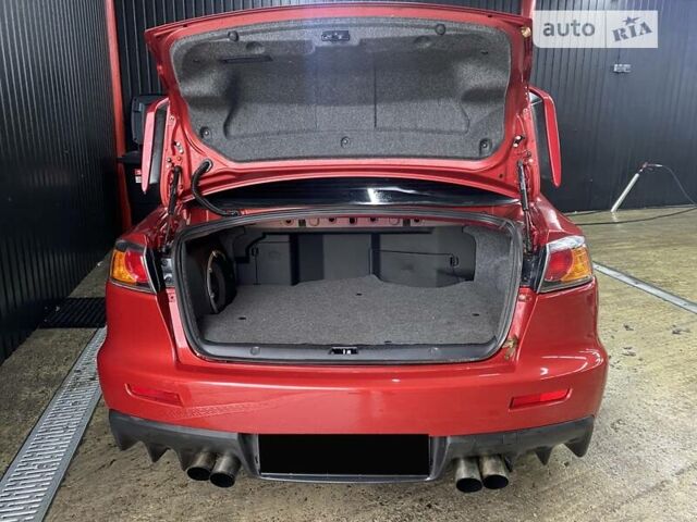 Красный Мицубиси Лансер Эволюшн, объемом двигателя 2 л и пробегом 56 тыс. км за 29000 $, фото 14 на Automoto.ua