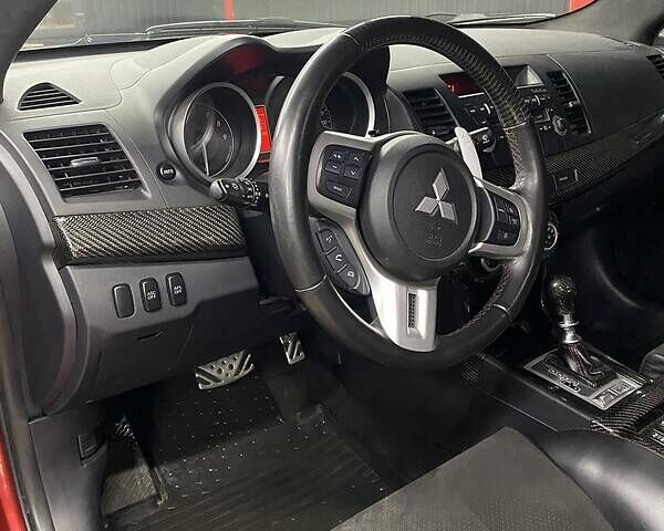 Красный Мицубиси Лансер Эволюшн, объемом двигателя 2 л и пробегом 56 тыс. км за 29000 $, фото 19 на Automoto.ua