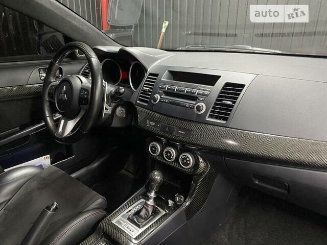 Красный Мицубиси Лансер Эволюшн, объемом двигателя 2 л и пробегом 56 тыс. км за 29000 $, фото 17 на Automoto.ua