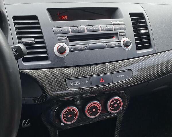 Красный Мицубиси Лансер Эволюшн, объемом двигателя 2 л и пробегом 56 тыс. км за 29000 $, фото 22 на Automoto.ua