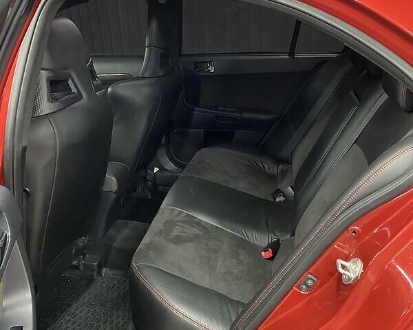 Красный Мицубиси Лансер Эволюшн, объемом двигателя 2 л и пробегом 56 тыс. км за 29000 $, фото 26 на Automoto.ua