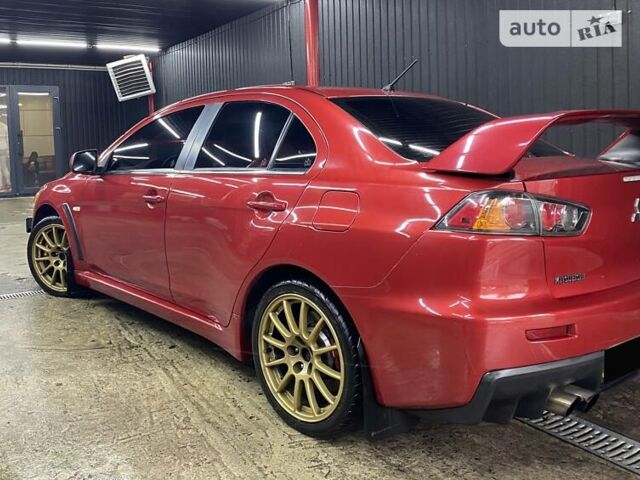 Красный Мицубиси Лансер Эволюшн, объемом двигателя 2 л и пробегом 56 тыс. км за 29000 $, фото 10 на Automoto.ua
