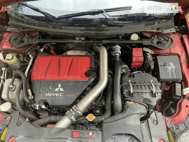 Красный Мицубиси Лансер Эволюшн, объемом двигателя 2 л и пробегом 56 тыс. км за 29000 $, фото 13 на Automoto.ua
