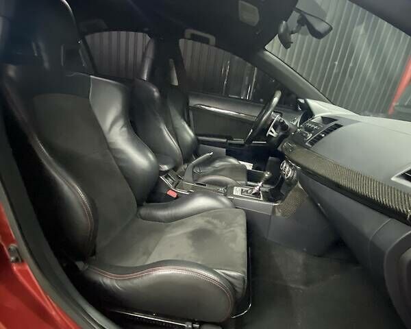 Красный Мицубиси Лансер Эволюшн, объемом двигателя 2 л и пробегом 56 тыс. км за 29000 $, фото 25 на Automoto.ua