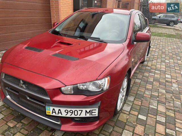 Красный Мицубиси Лансер Эволюшн, объемом двигателя 2 л и пробегом 110 тыс. км за 17000 $, фото 4 на Automoto.ua