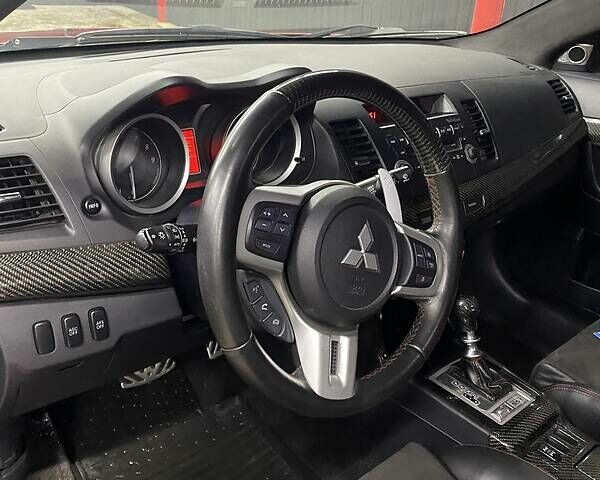 Красный Мицубиси Лансер Эволюшн, объемом двигателя 2 л и пробегом 56 тыс. км за 29000 $, фото 18 на Automoto.ua