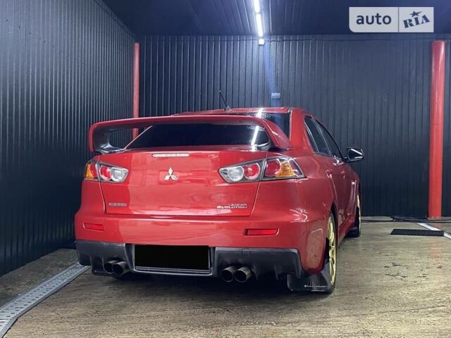 Красный Мицубиси Лансер Эволюшн, объемом двигателя 2 л и пробегом 56 тыс. км за 29000 $, фото 7 на Automoto.ua