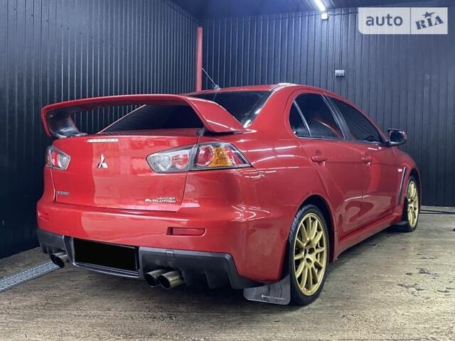 Красный Мицубиси Лансер Эволюшн, объемом двигателя 2 л и пробегом 56 тыс. км за 29000 $, фото 8 на Automoto.ua