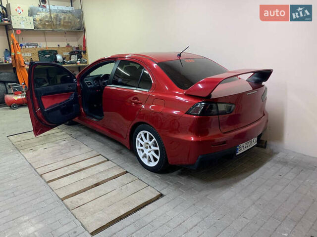 Красный Мицубиси Лансер Эволюшн, объемом двигателя 2 л и пробегом 115 тыс. км за 18000 $, фото 4 на Automoto.ua
