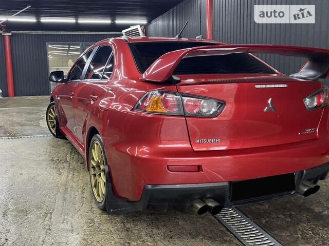 Красный Мицубиси Лансер Эволюшн, объемом двигателя 2 л и пробегом 56 тыс. км за 29000 $, фото 9 на Automoto.ua