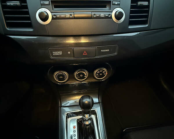 Червоний Міцубісі Лансер Еволюшн, об'ємом двигуна 2 л та пробігом 105 тис. км за 16700 $, фото 19 на Automoto.ua