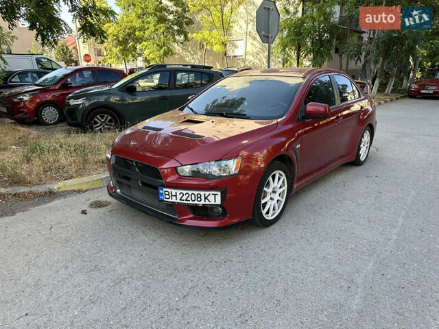 Красный Мицубиси Лансер Эволюшн, объемом двигателя 2 л и пробегом 115 тыс. км за 18000 $, фото 5 на Automoto.ua