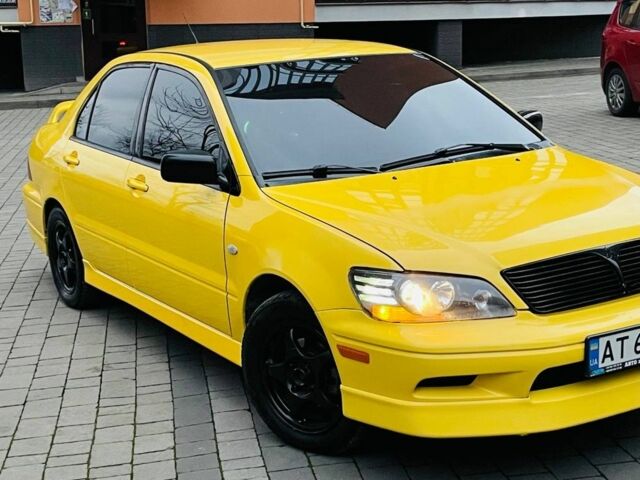 Жовтий Міцубісі Лансер Еволюшн, об'ємом двигуна 2 л та пробігом 160 тис. км за 3999 $, фото 2 на Automoto.ua