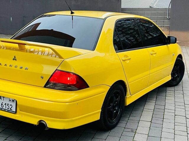 Жовтий Міцубісі Лансер Еволюшн, об'ємом двигуна 2 л та пробігом 160 тис. км за 3999 $, фото 1 на Automoto.ua