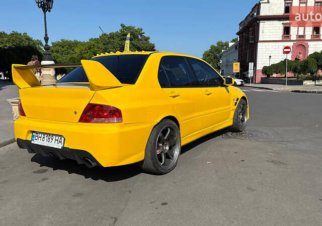 Жовтий Міцубісі Лансер Еволюшн, об'ємом двигуна 2 л та пробігом 124 тис. км за 32000 $, фото 8 на Automoto.ua