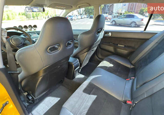 Жовтий Міцубісі Лансер Еволюшн, об'ємом двигуна 2 л та пробігом 124 тис. км за 32000 $, фото 23 на Automoto.ua