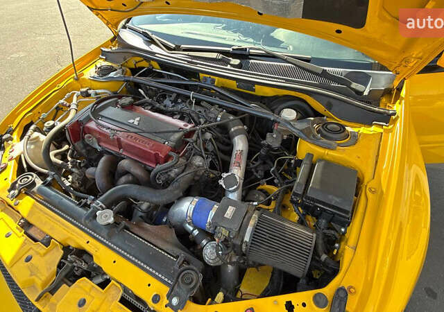 Жовтий Міцубісі Лансер Еволюшн, об'ємом двигуна 2 л та пробігом 124 тис. км за 32000 $, фото 6 на Automoto.ua