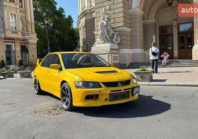 Жовтий Міцубісі Лансер Еволюшн, об'ємом двигуна 2 л та пробігом 124 тис. км за 32000 $, фото 18 на Automoto.ua