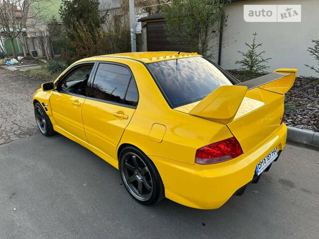Желтый Мицубиси Лансер Эволюшн, объемом двигателя 2 л и пробегом 129 тыс. км за 33500 $, фото 4 на Automoto.ua