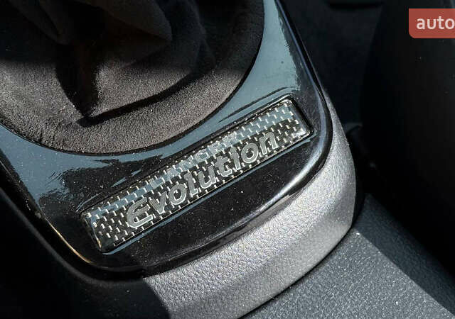 Жовтий Міцубісі Лансер Еволюшн, об'ємом двигуна 2 л та пробігом 124 тис. км за 32000 $, фото 9 на Automoto.ua