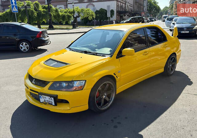 Жовтий Міцубісі Лансер Еволюшн, об'ємом двигуна 2 л та пробігом 124 тис. км за 32000 $, фото 20 на Automoto.ua