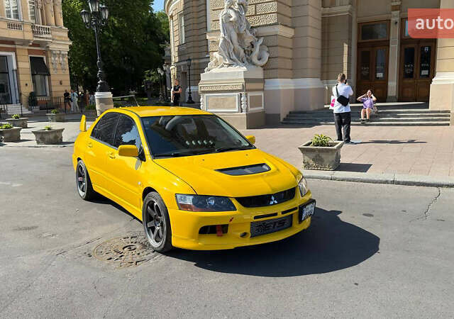 Жовтий Міцубісі Лансер Еволюшн, об'ємом двигуна 2 л та пробігом 124 тис. км за 32000 $, фото 19 на Automoto.ua