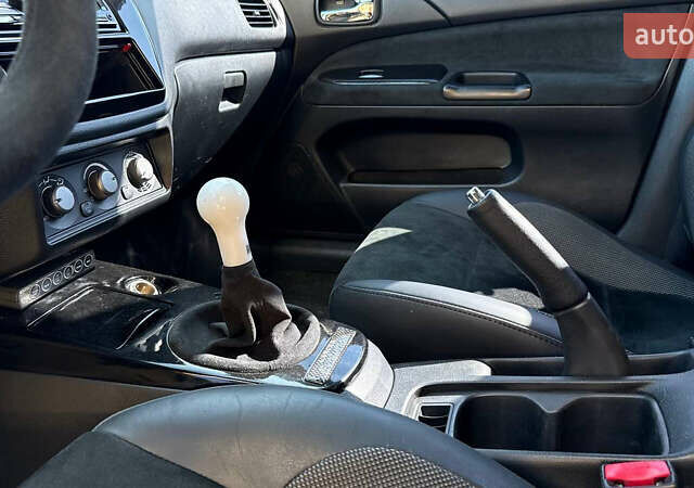 Жовтий Міцубісі Лансер Еволюшн, об'ємом двигуна 2 л та пробігом 124 тис. км за 32000 $, фото 3 на Automoto.ua