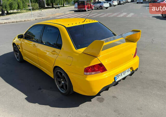 Жовтий Міцубісі Лансер Еволюшн, об'ємом двигуна 2 л та пробігом 124 тис. км за 32000 $, фото 26 на Automoto.ua