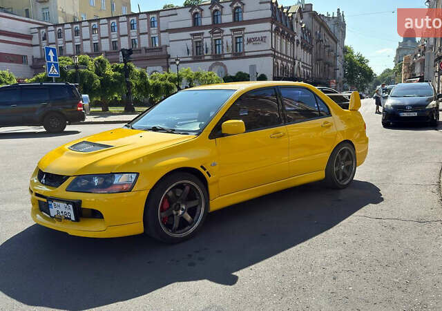 Жовтий Міцубісі Лансер Еволюшн, об'ємом двигуна 2 л та пробігом 124 тис. км за 32000 $, фото 21 на Automoto.ua